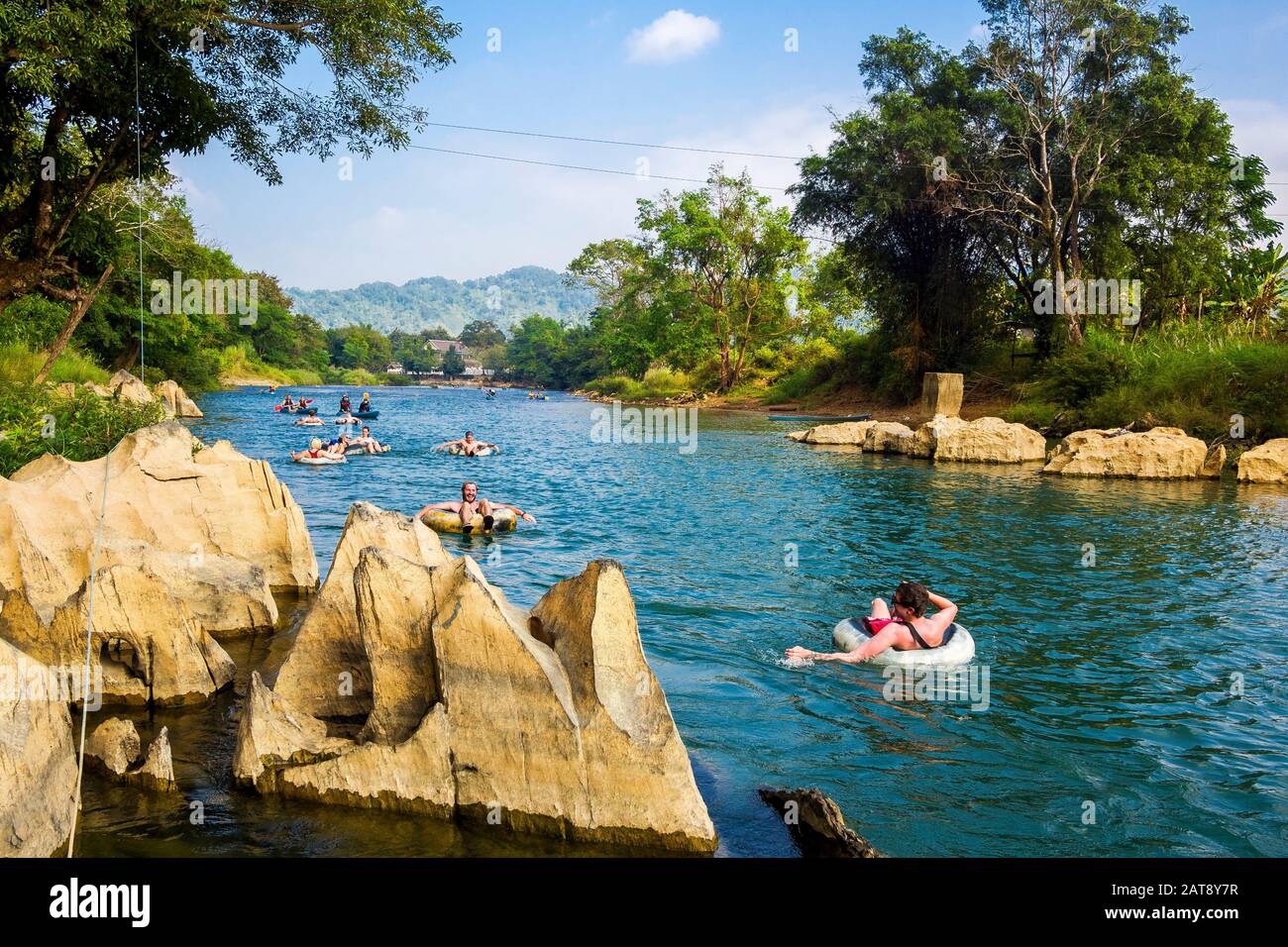 Tourists tubing down the Song River at Vang Vieng, Vientiane Province, Laos. Stock Photo