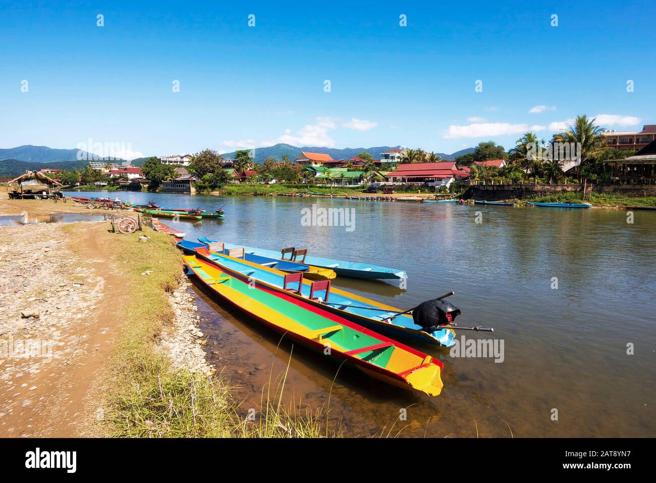Boats on the Song River in Vang Vieng, Laos. Stock Photo
