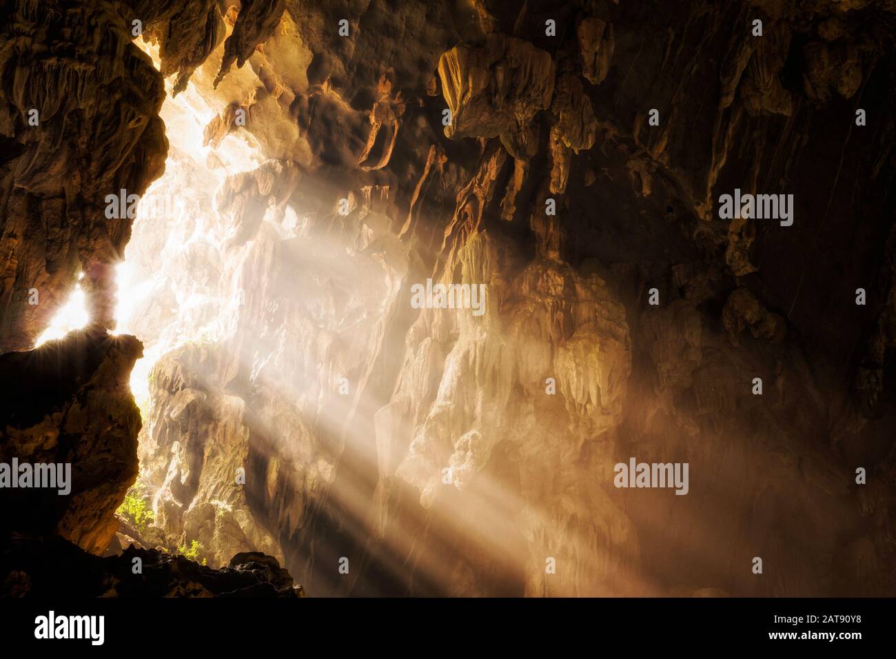 Light shinning through cave opening at Tham Phu Kham Cave in Vang Vieng, Vientiane Province, Laos. Stock Photo
