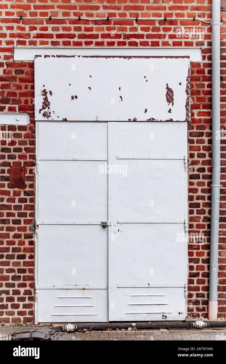 Old metal door with rust and cracking paint Stock Photo Alamy