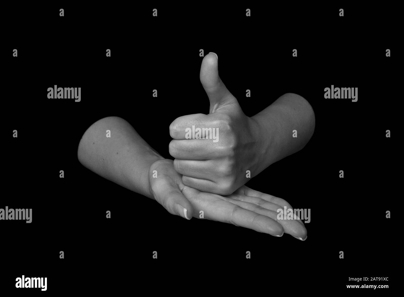 The word HELP in British sign language on an isolated black background ...