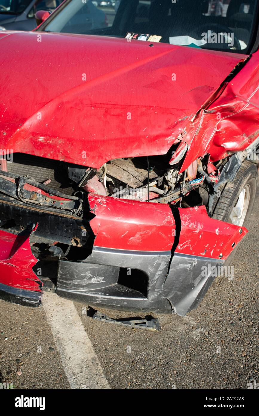 Front of red car get damaged by accident on the road Stock Photo Alamy