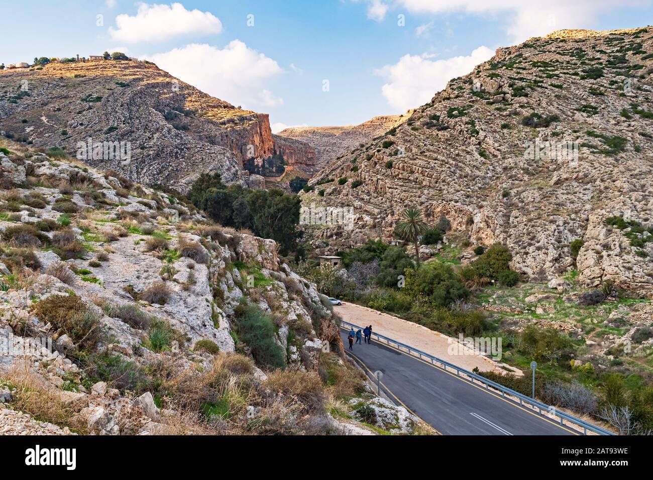 tourists returning from the faran monastery in the ein prat reserve in the west bank sowing the canyon and old british pumping station and ruins of an Stock Photo