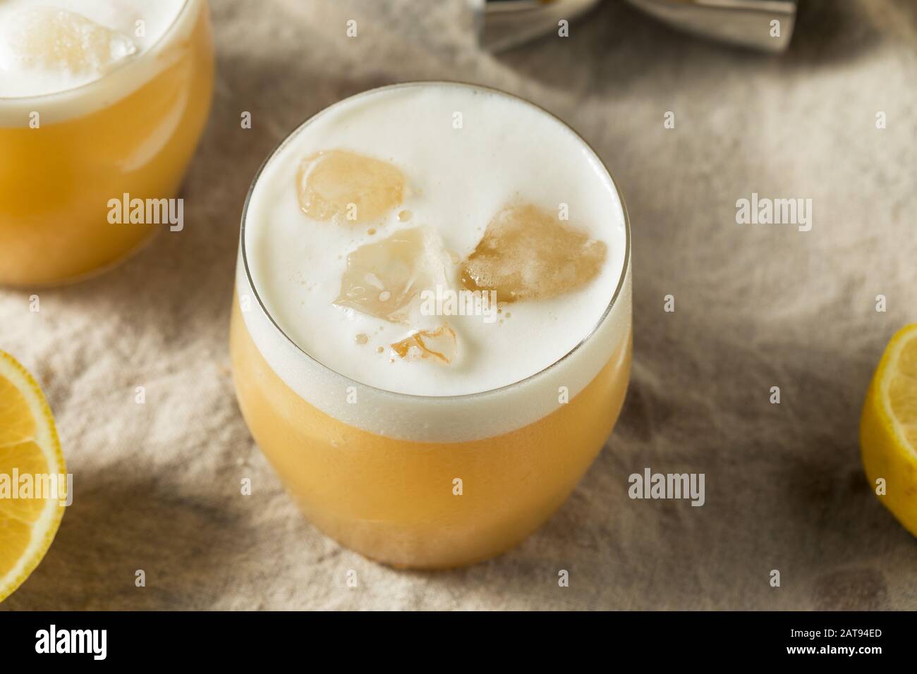 Alcoholic Tequila Lemon Sour Cocktail with Egg White Stock Photo Alamy