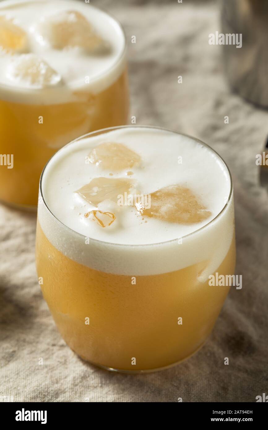 Alcoholic Tequila Lemon Sour Cocktail with Egg White Stock Photo Alamy