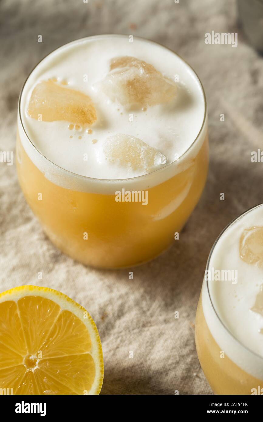 Alcoholic Tequila Lemon Sour Cocktail with Egg White Stock Photo Alamy