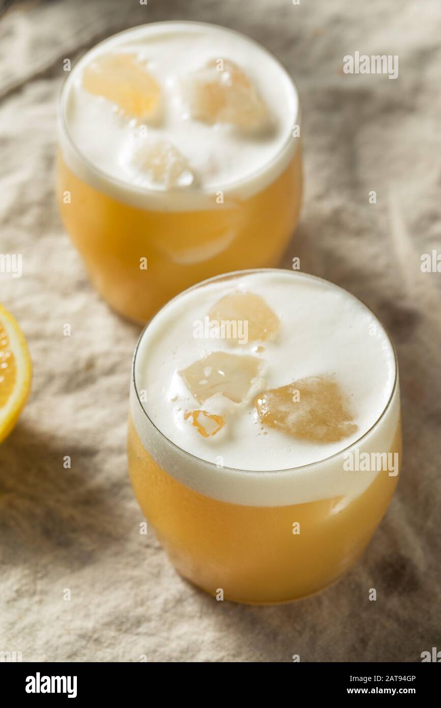 Alcoholic Tequila Lemon Sour Cocktail with Egg White Stock Photo Alamy