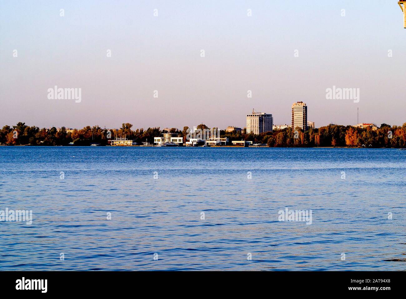 Left side of Dnipro city, Ukraine. Panoramic view of Dnipro river. Cityscape Housing estate Sunny with buildings. Stock Photo
