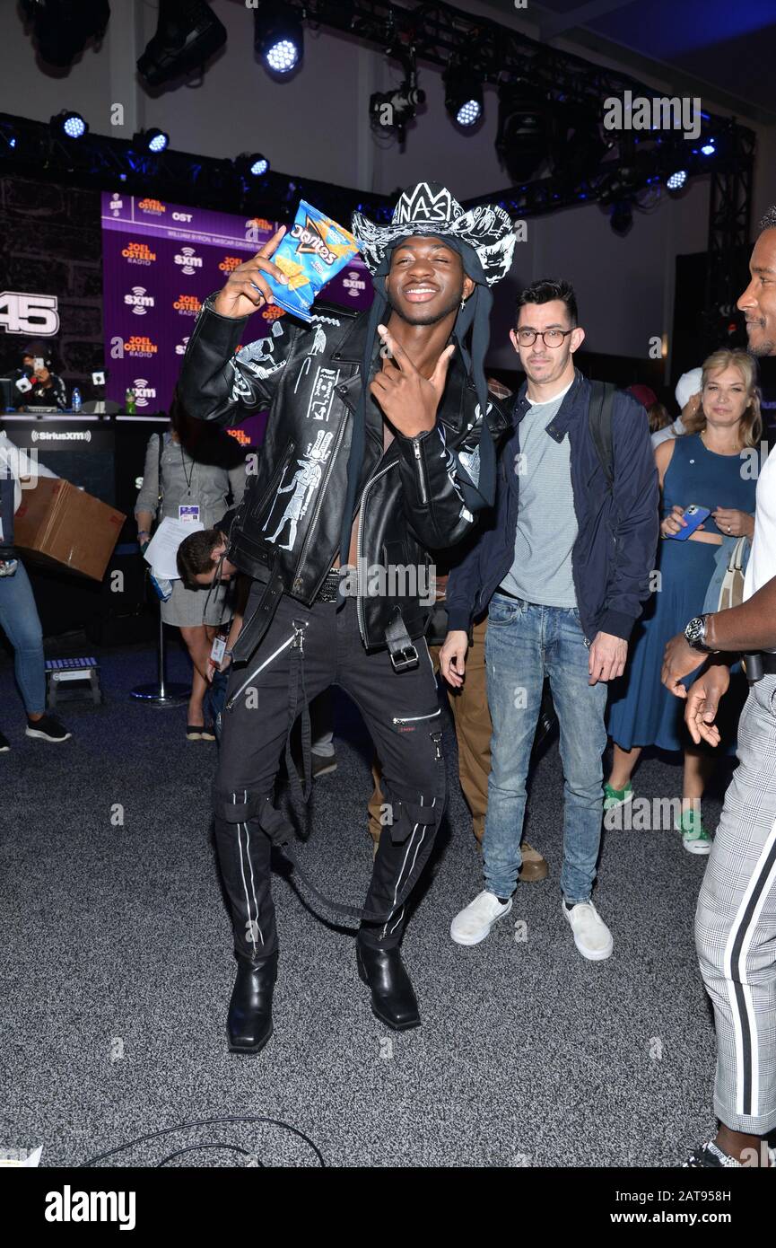 Miami, USA. 31st Jan, 2020. Lil Nas X holds a bag of Doritos at SiriusXM on  radio row for Super Bowl LIV held at the Miami Beach Convention Center in  Miami, Florida