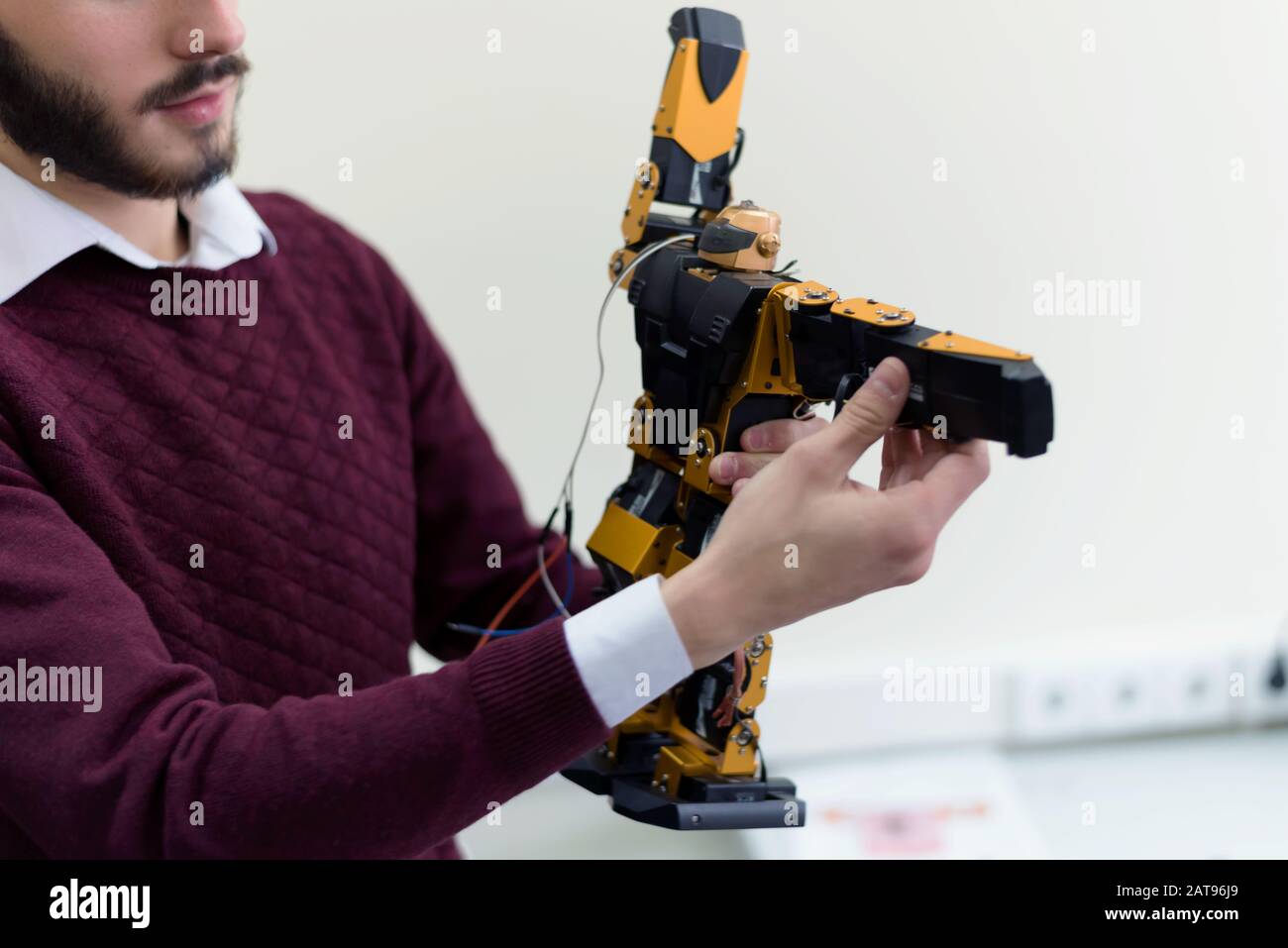 Group of young engineers working on robotics project. Scientist ...