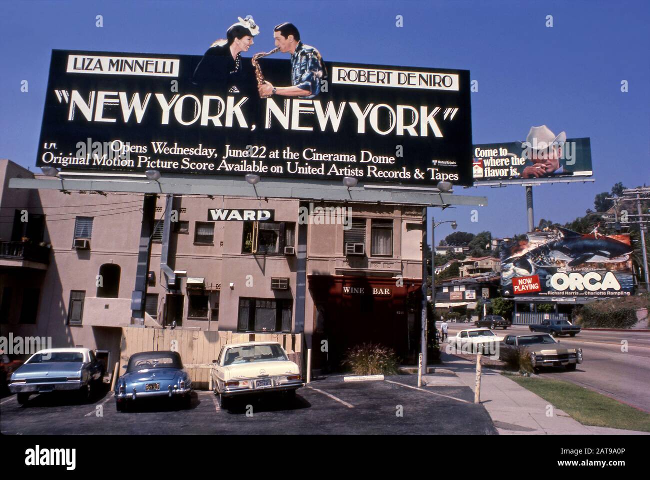 Billboards on the Sunset Strip including Liza Minelli, Robert DeNiro in New York, New York, the Marlboro Man and the movie Orca in July of 1977. Stock Photo