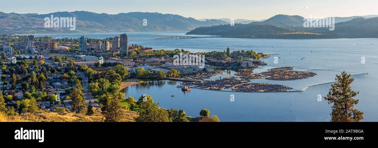 A high resolution panorama of the Kelowna British Columbia skyline and Okanagan Lake with the R W Bennett Bridge in the background, from Knox Mountain Stock Photo