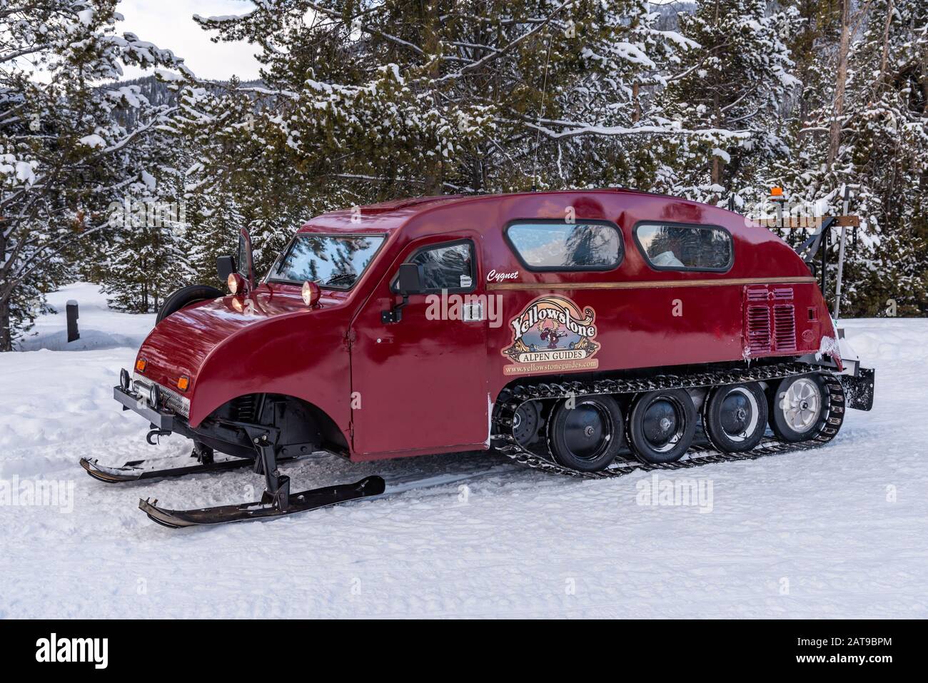 A Bombardier vehicle fitted to travel in winter snow. Yellowstone National Park, Wyoming, USA Stock Photo