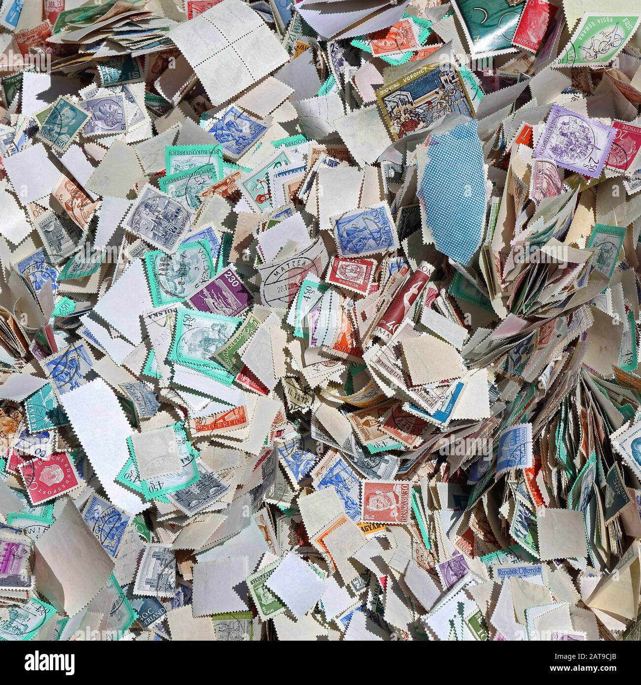 Used Unsorted Postage Stamps at Flea Market Stock Photo