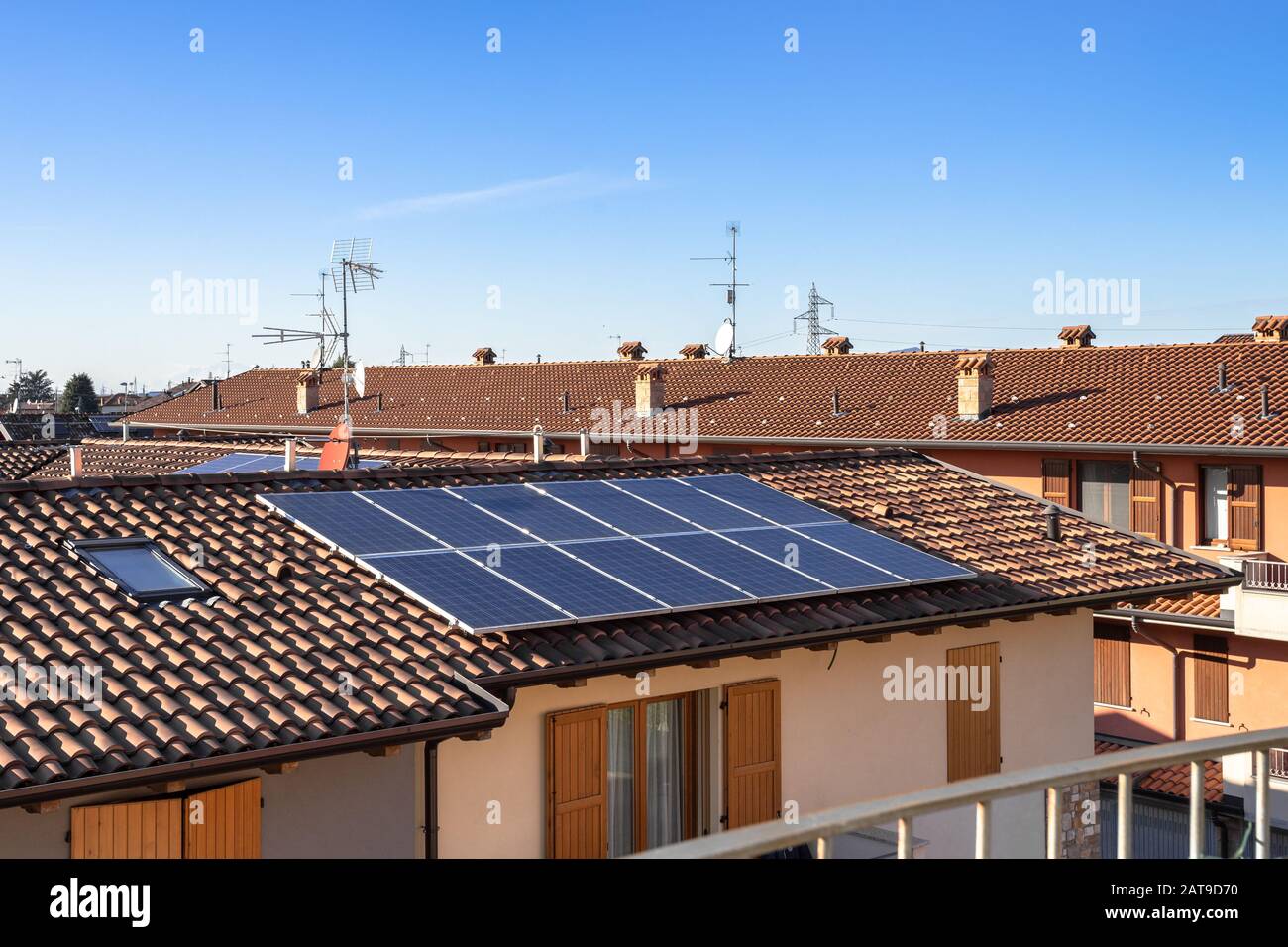 Solar panels on suburban Italian home. Photovoltaic power plant. Regenerative energy system electricity generation. Stock Photo
