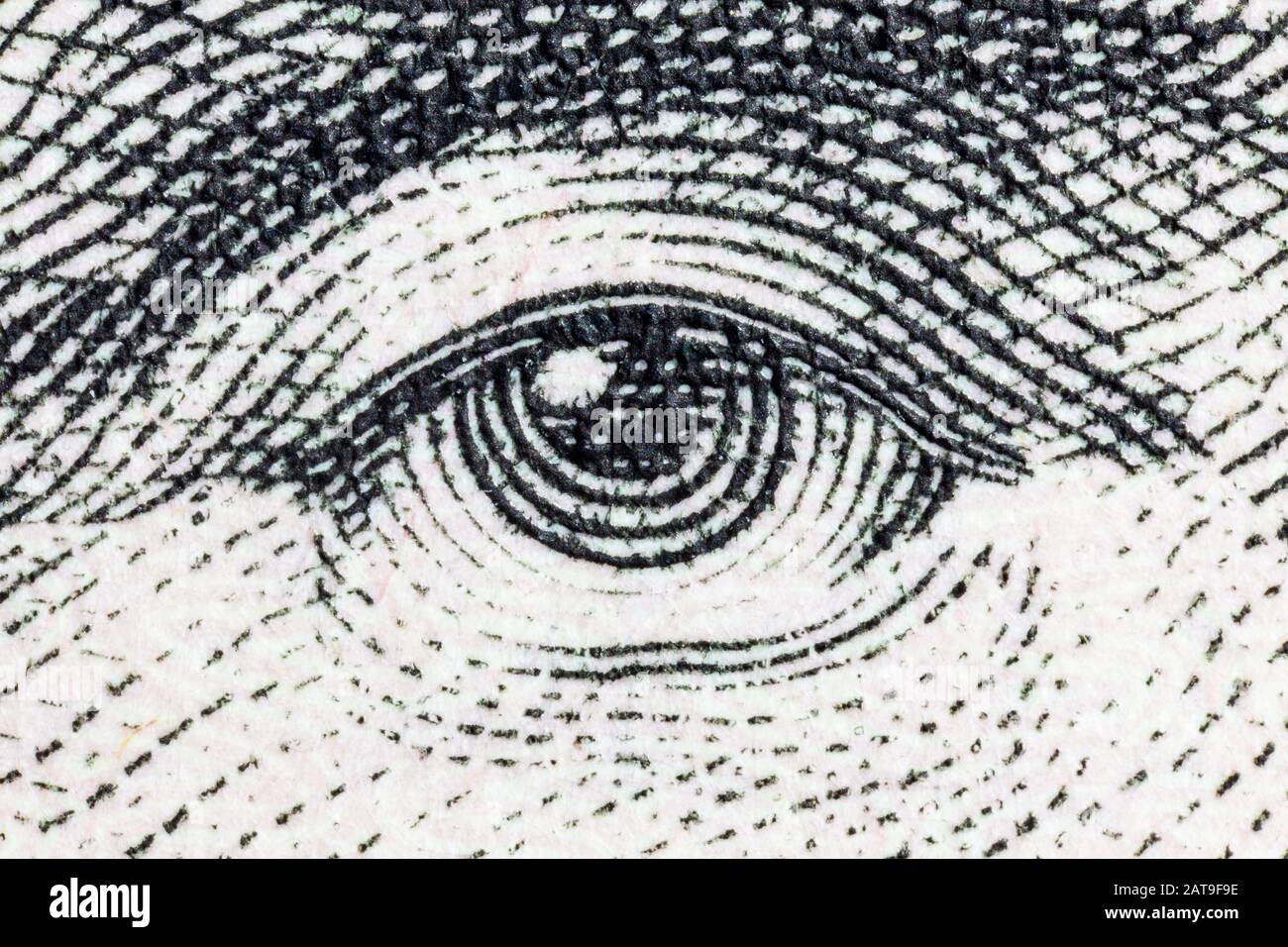 Macro close up photograph of Abraham Lincoln eye on the US five dollar bill. Stock Photo