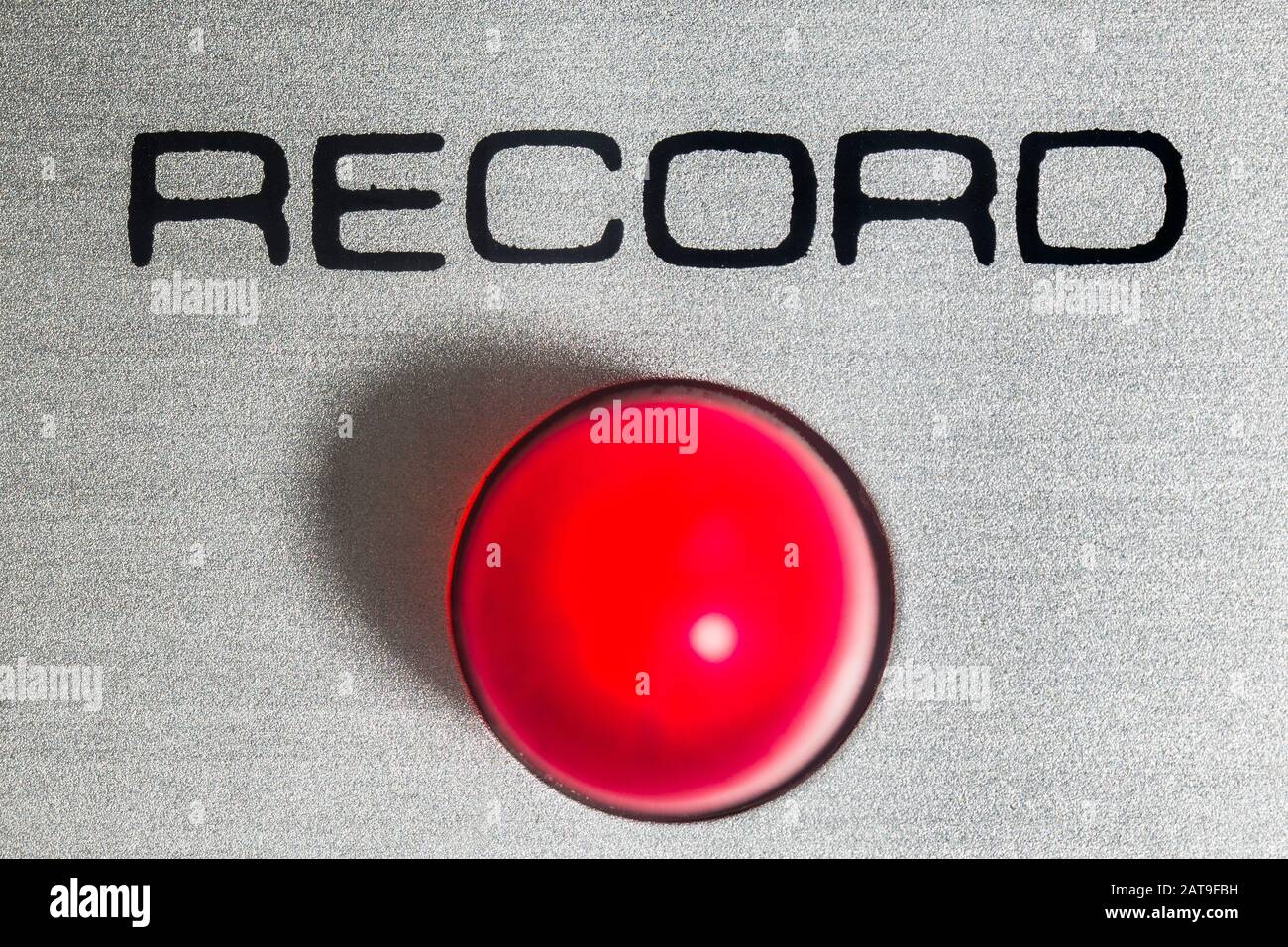 Macro close up photograph of record light on vintage eight track stereo tape machine. Stock Photo