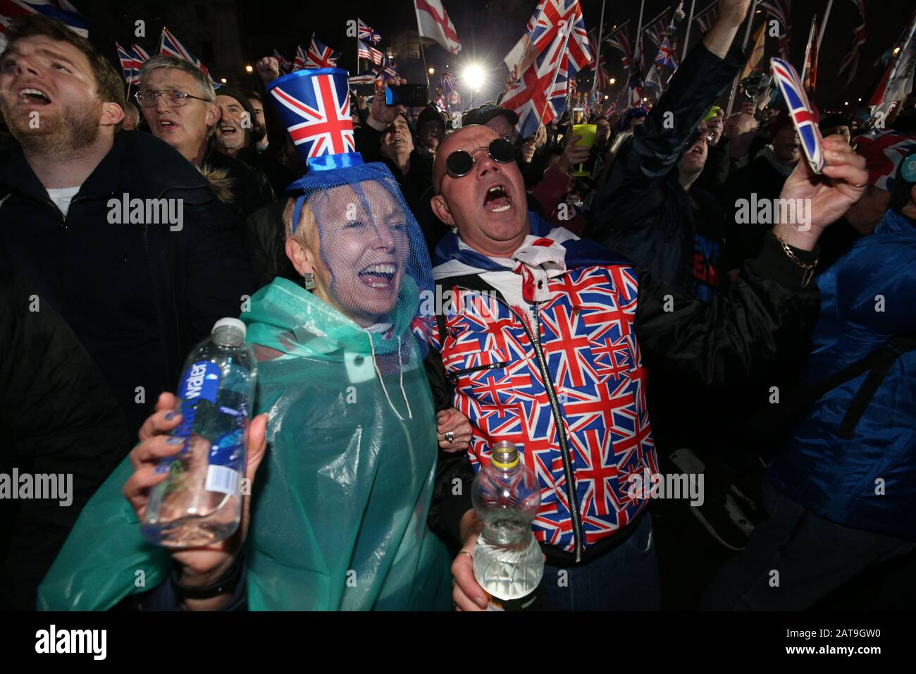 Pro-Brexit supporters celebrating in Parliament Square, London, after the UK left the European Union on Friday, ending 47 years of close and sometimes uncomfortable ties to Brussels. Stock Photo