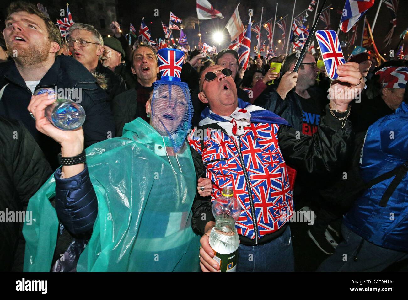 Pro-Brexit supporters celebrating in Parliament Square, London, after the UK left the European Union on Friday, ending 47 years of close and sometimes uncomfortable ties to Brussels. Stock Photo
