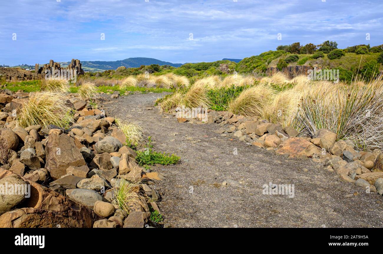 Gravel path with views to basalt rock formations at Bombo Headland quarry, New South Wales coast, Australia Stock Photo