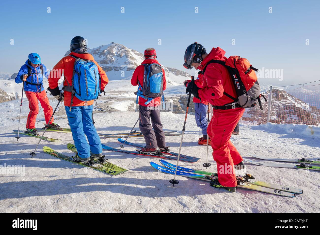 Dolomites, Italy - January 24, 2020: Group of off-piste skiers and their guide preparing to start a tour in Dolomites mountains, Italy. Stock Photo