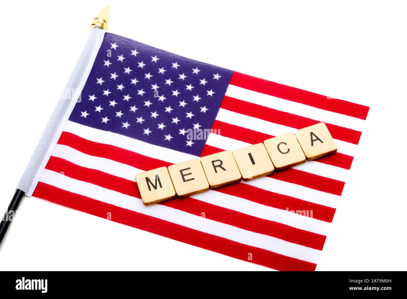 The flag of the United States isolated on a white background with a sign reading Merica Stock Photo