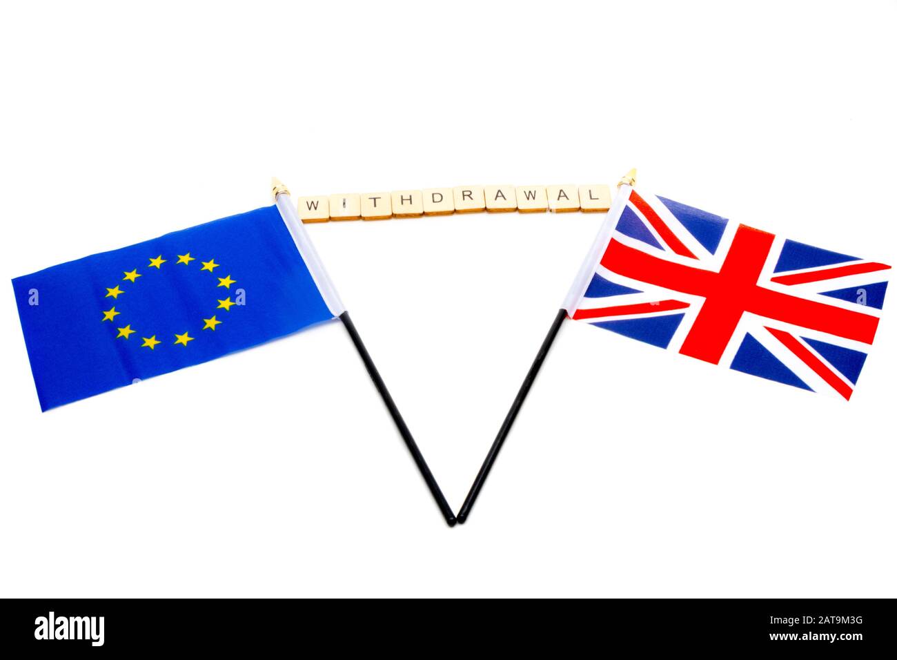 The flags of the European Union and the United Kingdom isolated on a white background with a sign reading Withdrawal Stock Photo