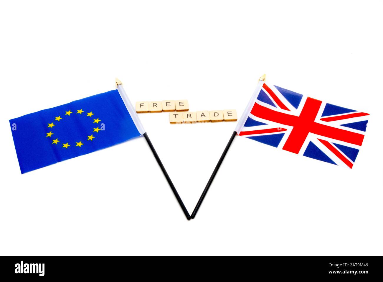 The flags of the European Union and the United Kingdom isolated on a white background with a sign reading Free Trade Stock Photo