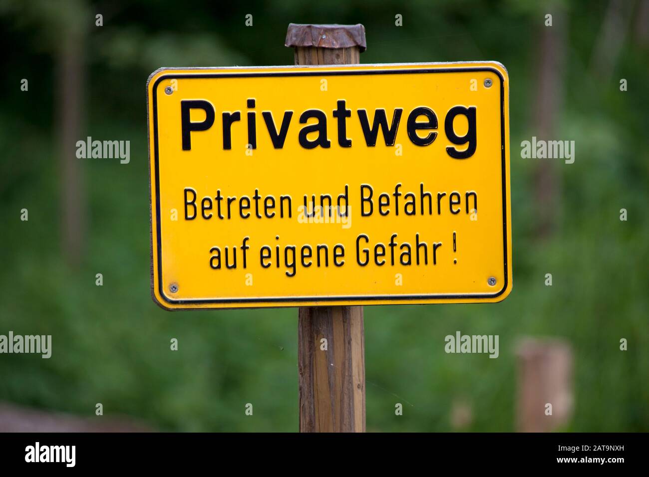 Private Ground Sign warning in german language Text translation 'Private ground, entry on own risk' Stock Photo