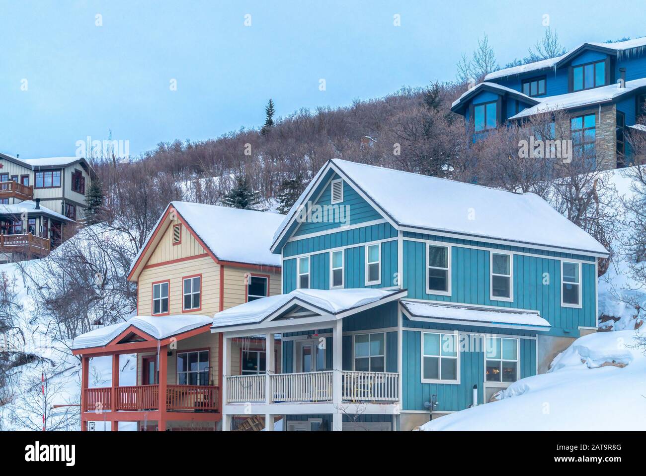 Beautiful homes in Park City Utah sitting on a hill covered with snow ...