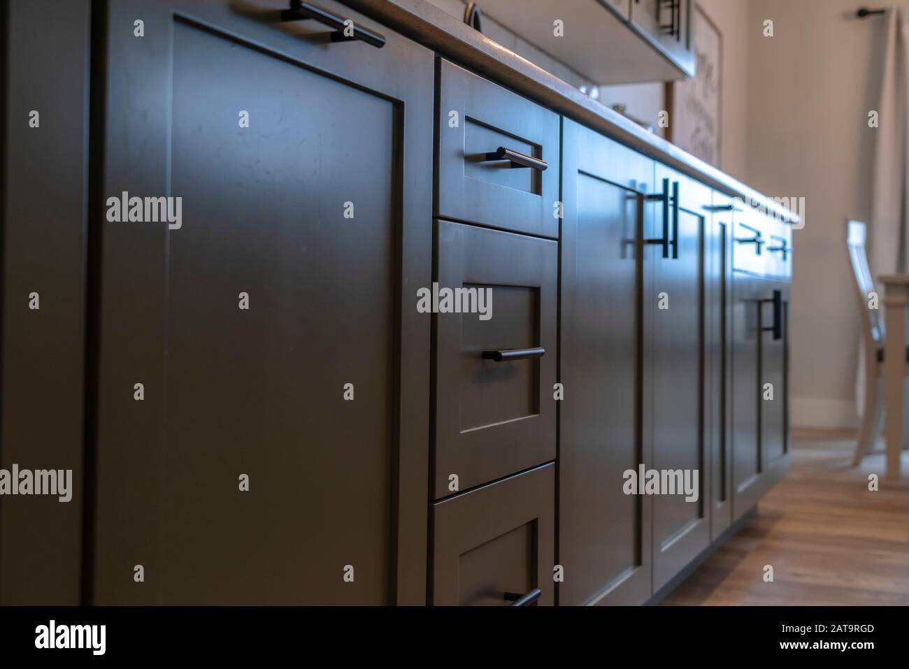 Beautiful Cabinetry With Black Handles And Drawers Under White