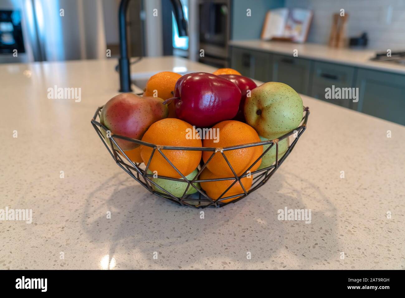 Wired Geometric Fruit Basket With Fresh Fruits At The Kitschen Island Of Home Stock Photo Alamy