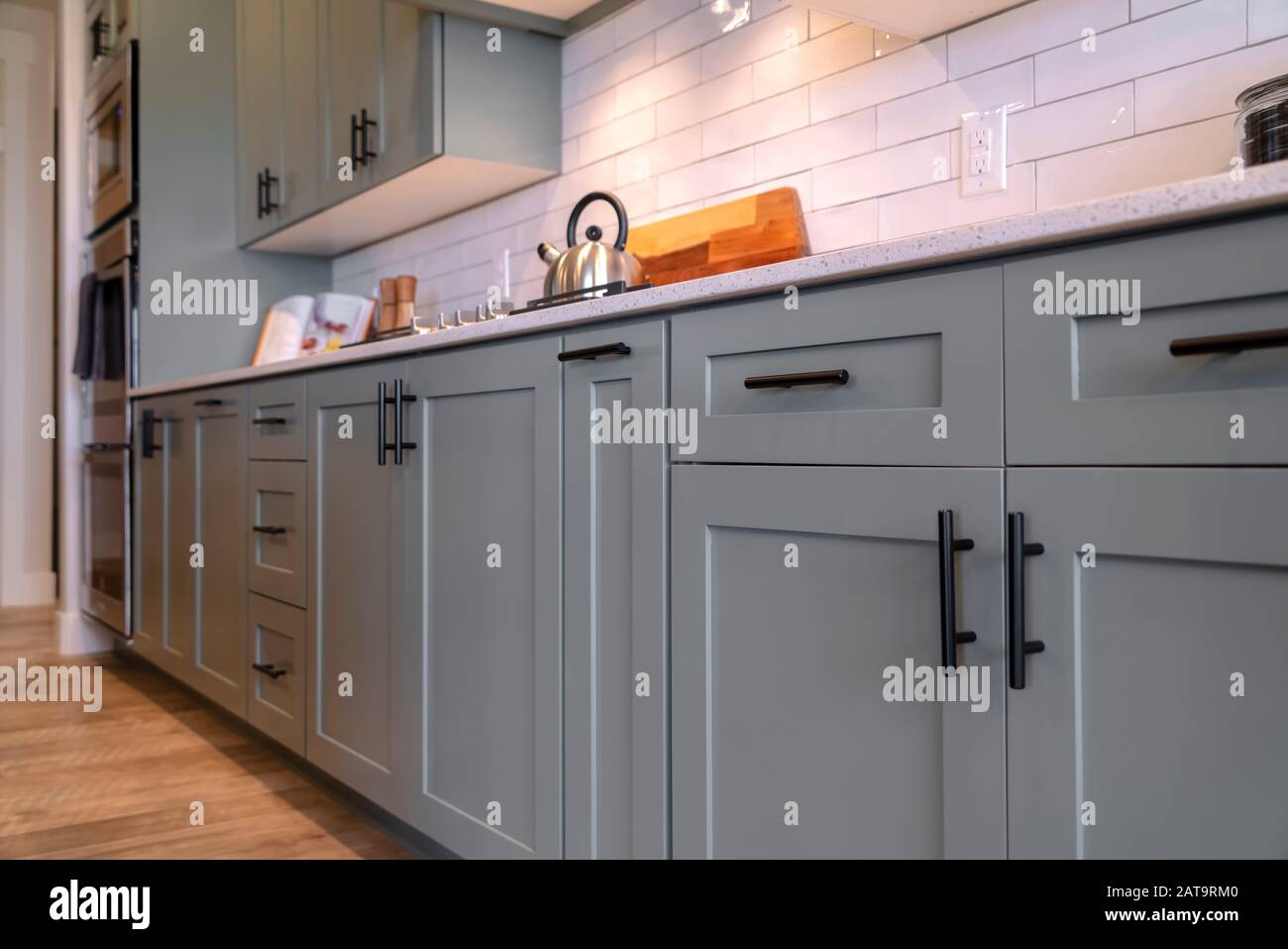 Kitchen Cabinets With White Countertop Black Handles And Tile