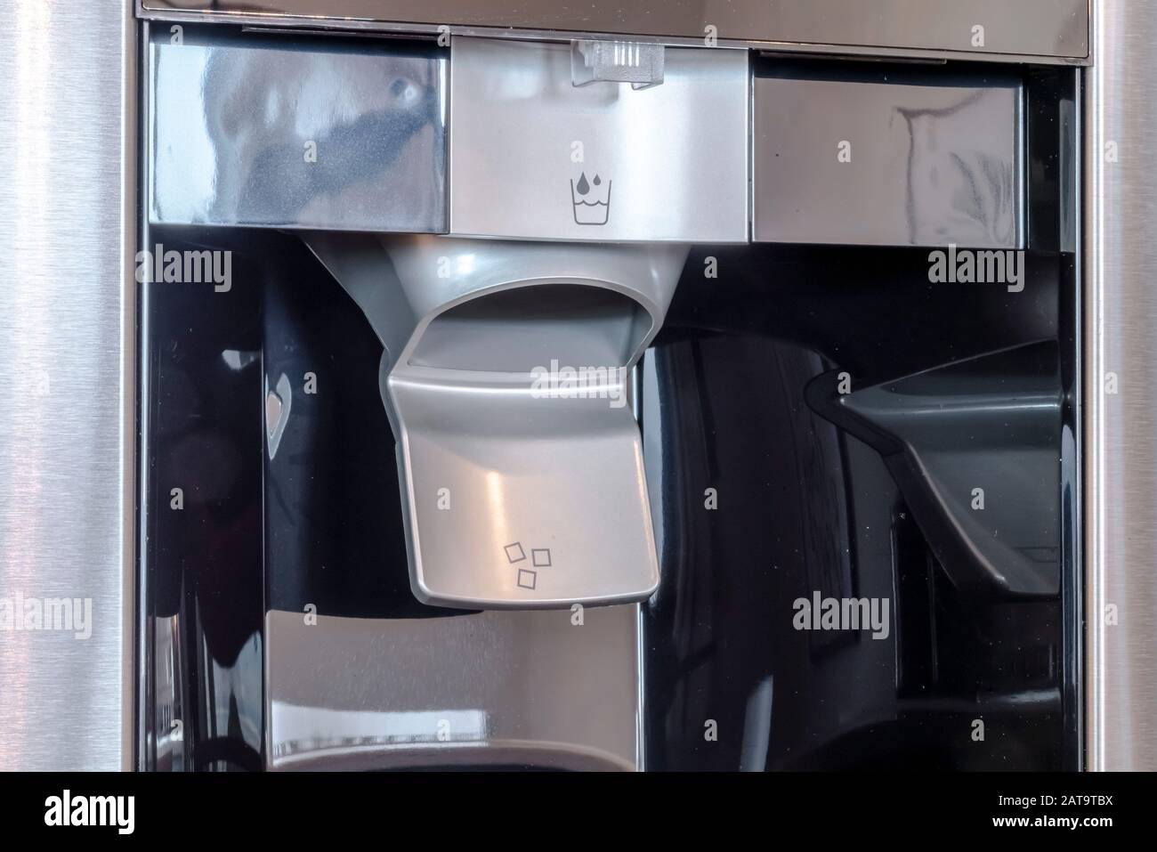 Ice and water dispenser on a refrigerator inside the kitchen of a home Stock Photo Alamy