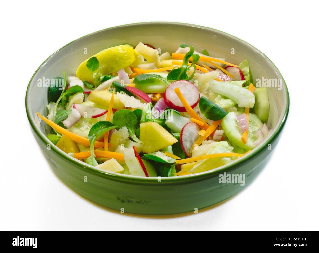 Close-up of vegetable salad in a green bowl on a white background Stock Photo