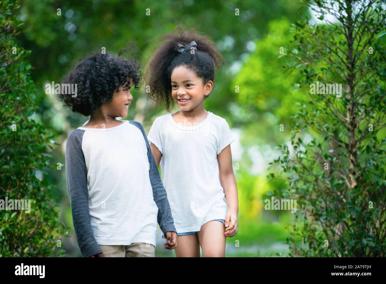 Happy Little Boy And Girl In The Park Two African American