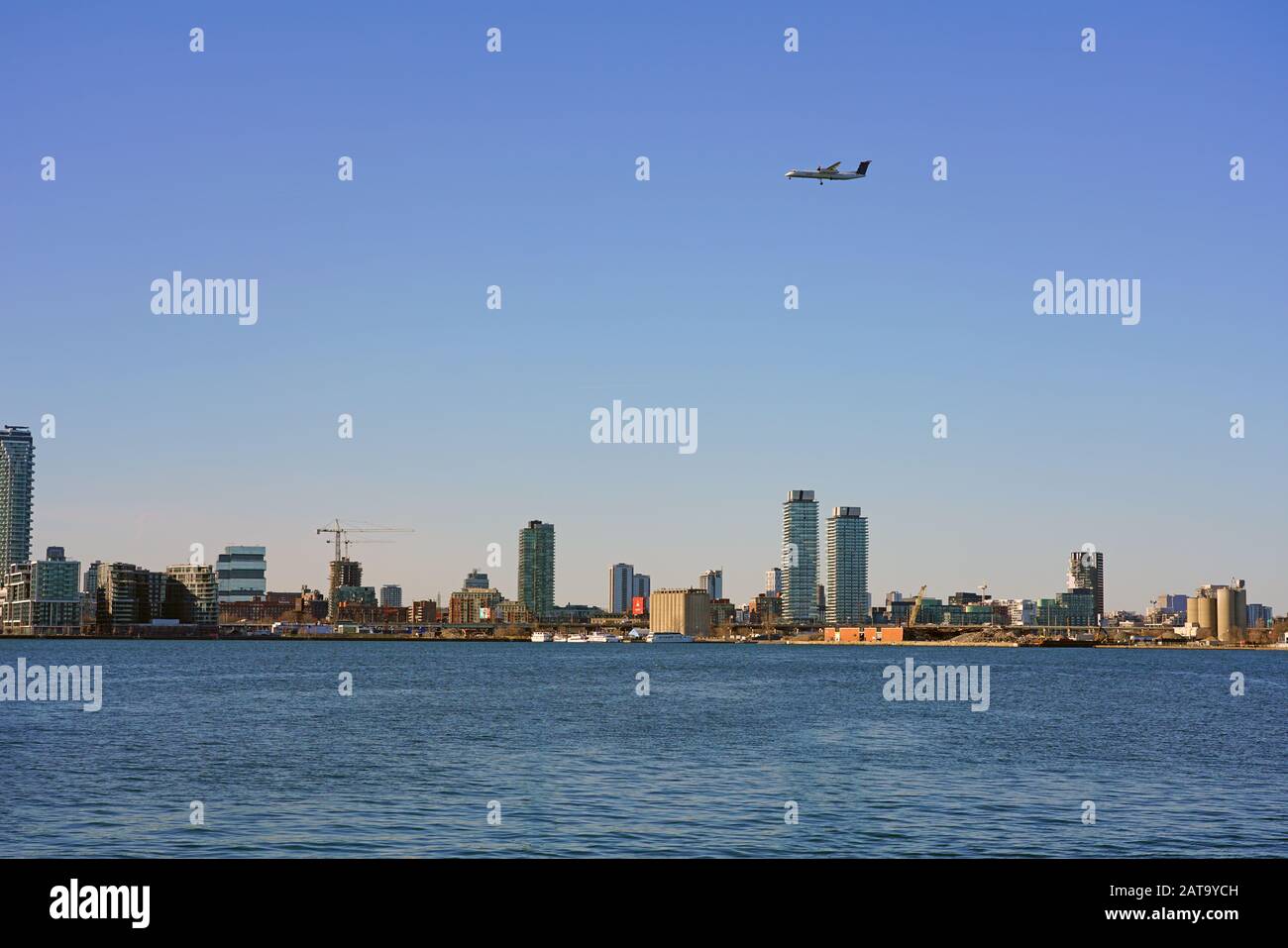 TORONTO, CANADA -26 MAR 2019- View of an airplane from Canadian airline Porter Airlines (PD) in approach at the Billy Bishop city airport (YTZ) over t Stock Photo