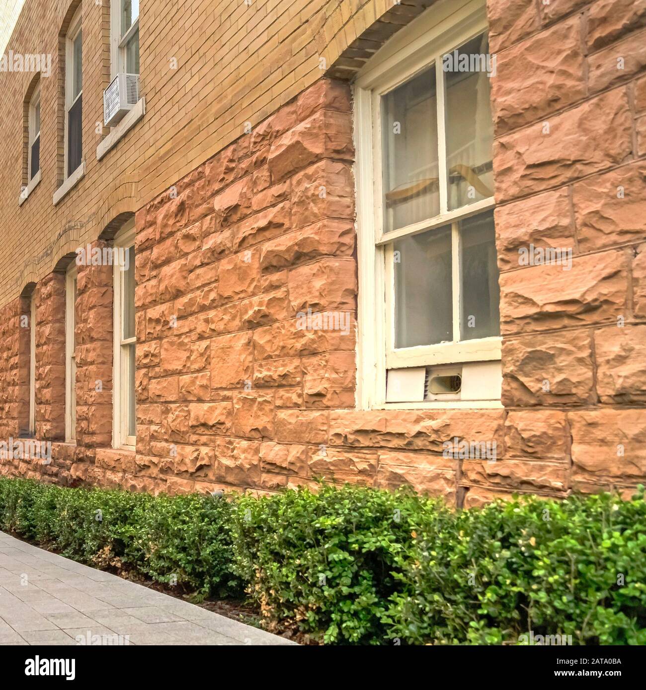 Square Frame Pathway Amid Residential Buildings Leading To A Fire