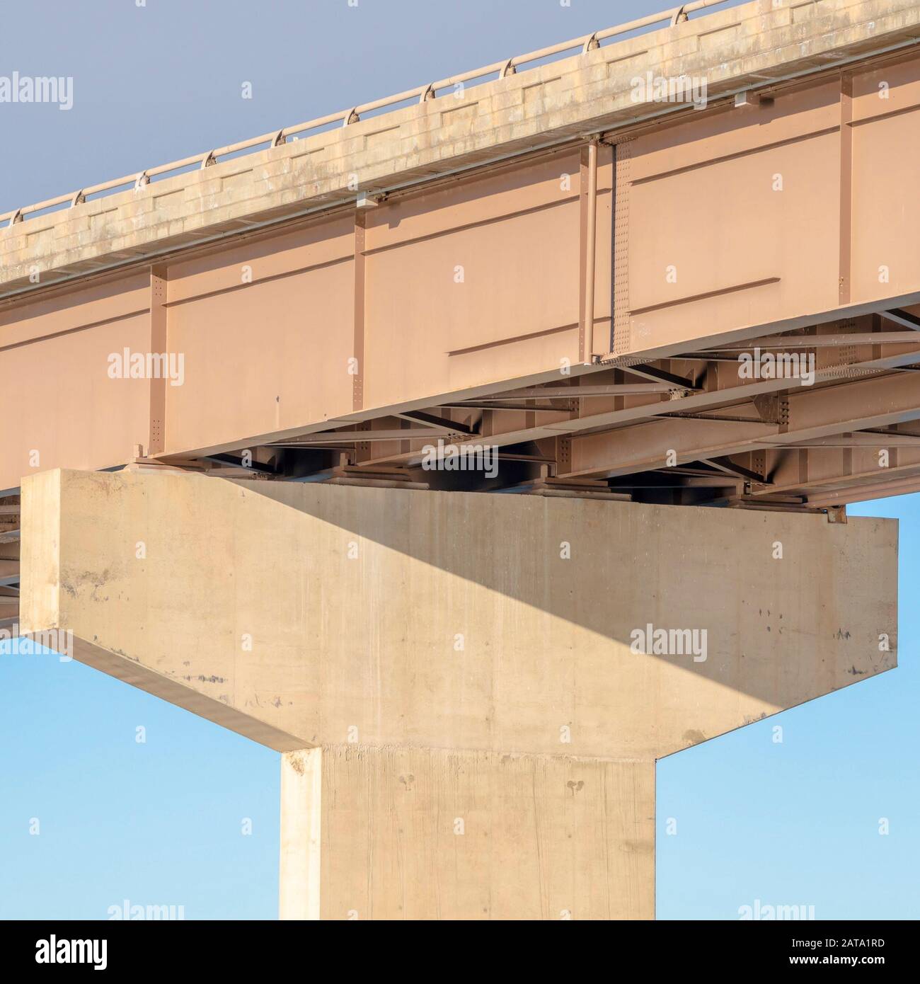 Square frame View beneath a stringer bridge with massive abutment that