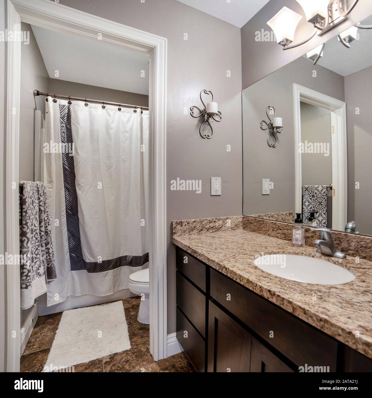 Square Home Bathroom With Gray Wall Brown Wooden Cabinet And