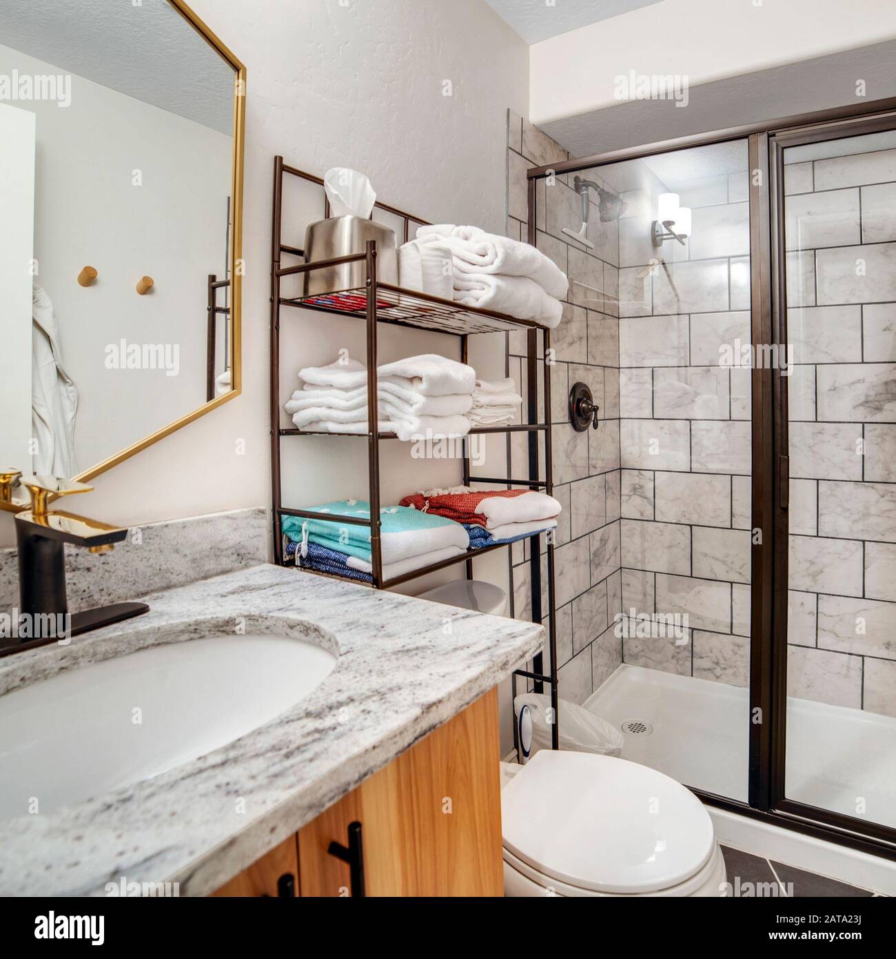 Square Bathroom Interior With Black And White Tile Wall And Marble