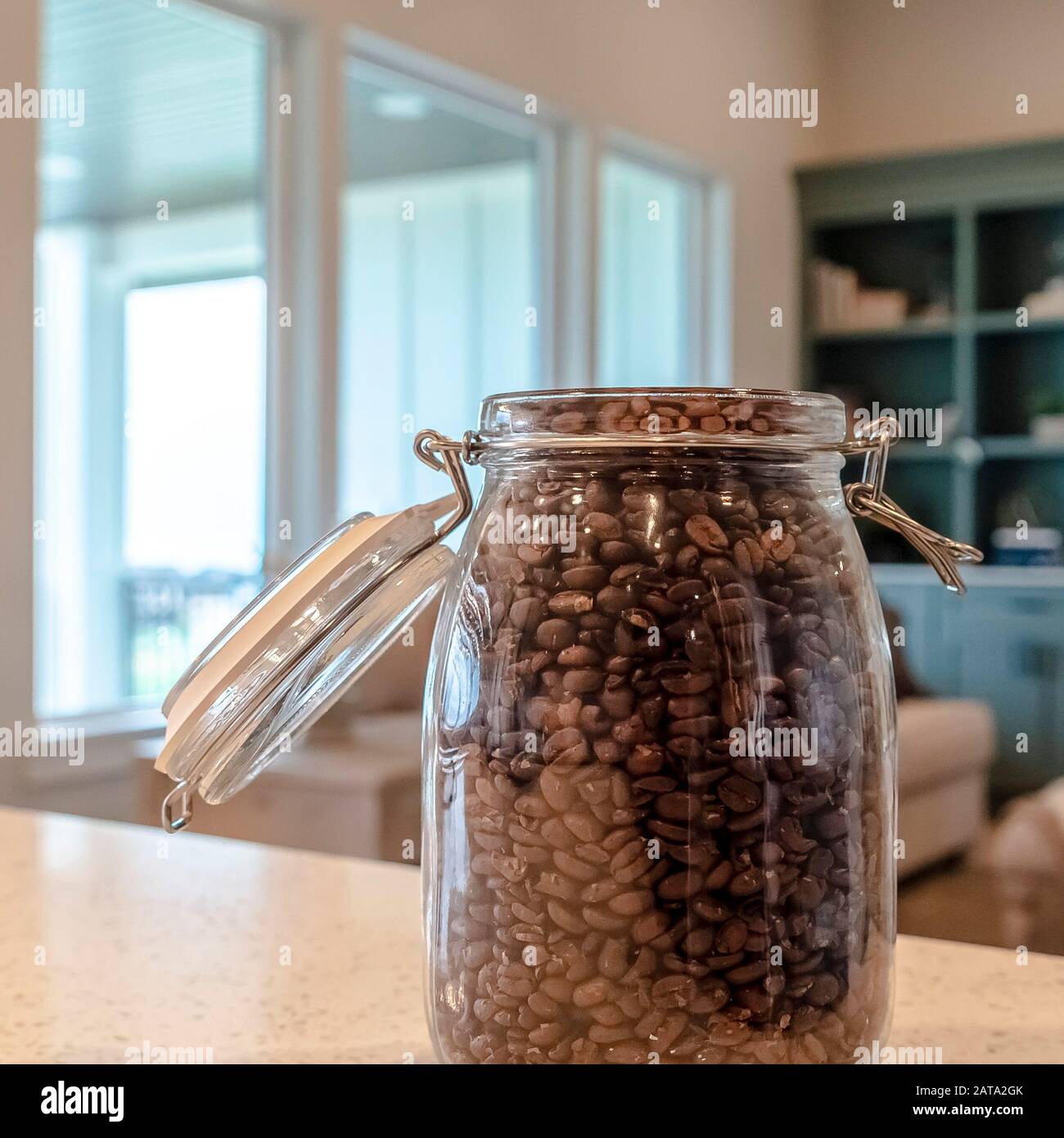 Download Photo Square Open Glass Jar Filled With Black Coffee Beans On Kitchen Counter Top Of Home Stock Photo Alamy PSD Mockup Templates