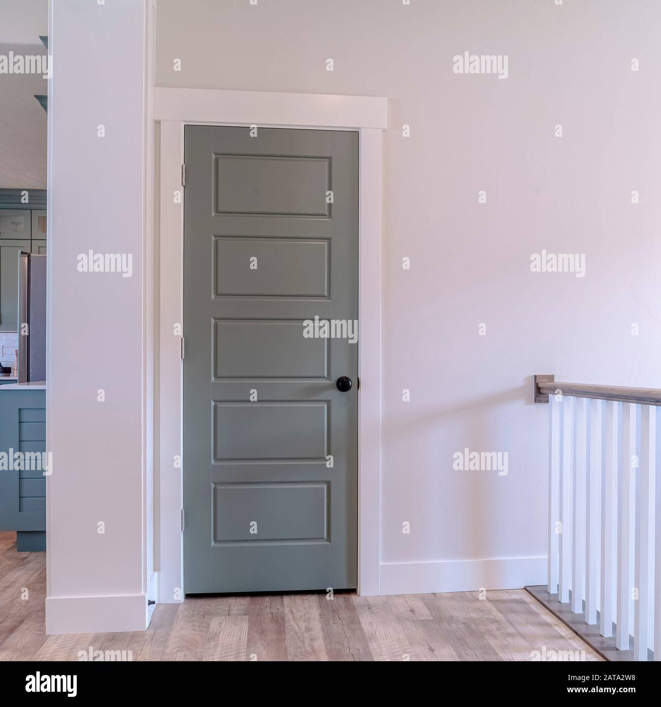Square frame Interior of house with gray door white wall and brown wooden floor Stock Photo Alamy