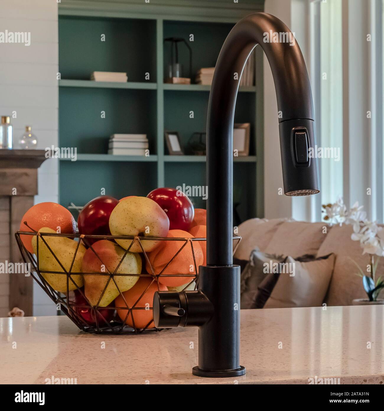 Square Frame Kitchen Island Sink With Black Faucet Fruit Basket And Double Basin Sink Stock Photo Alamy