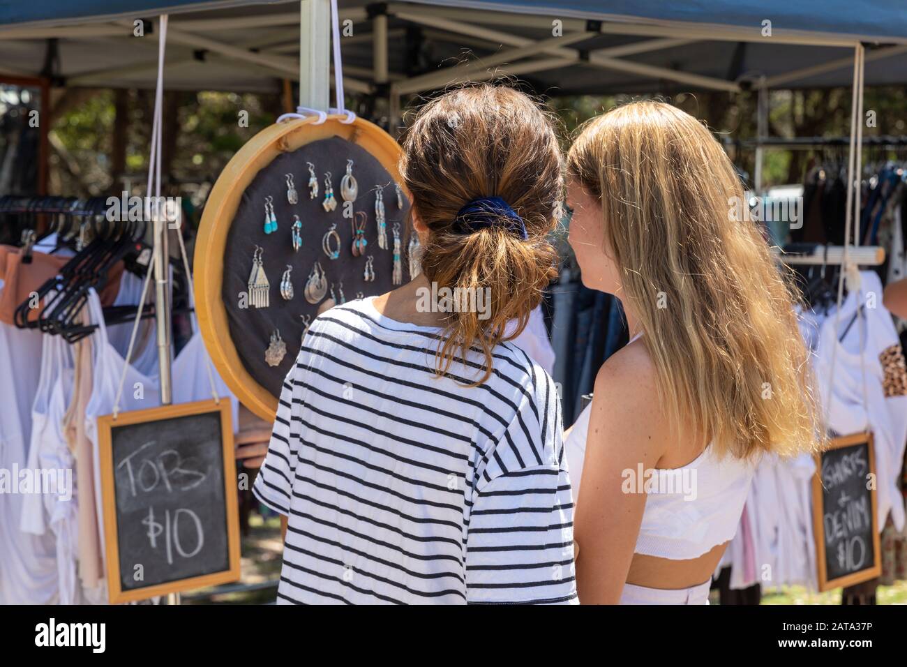 Byron Bay teenager girls model released shopping for jewellery at street market stall in Byron Bay , new south wales,Australia Stock Photo