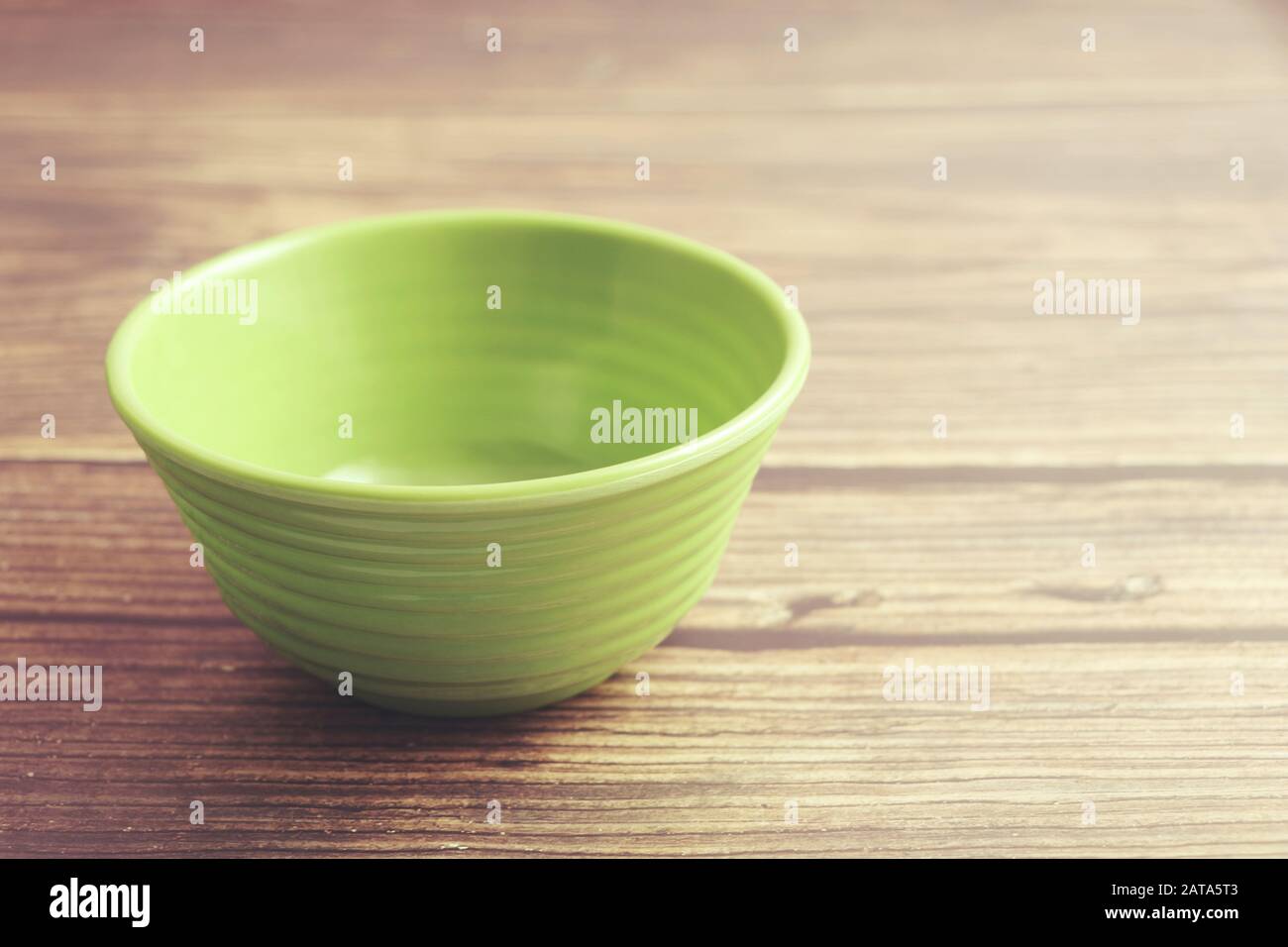 Indian made plastic bowl isolated on wooden table Stock Photo