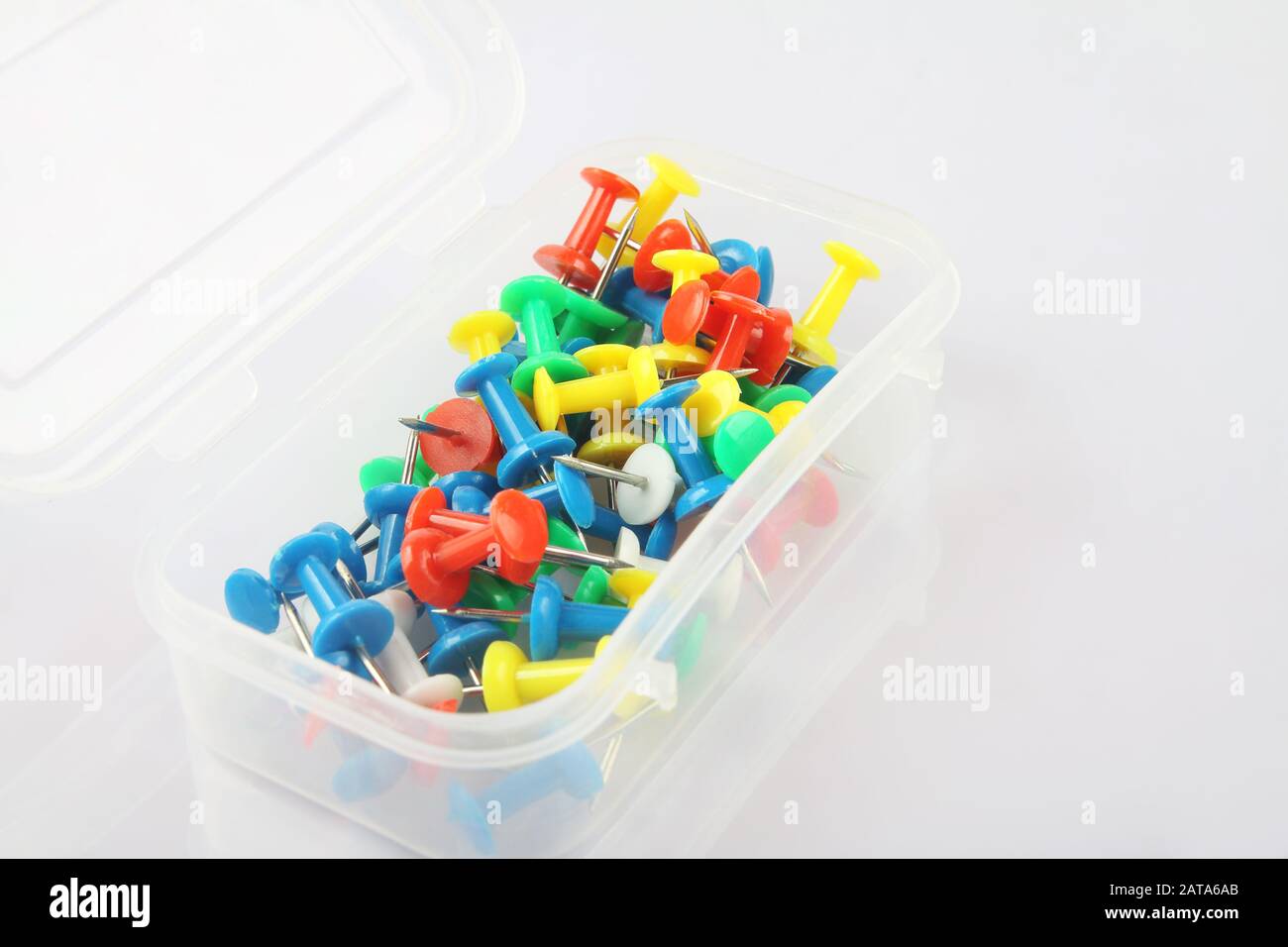 Metal push pins on white background Stock Photo - Alamy