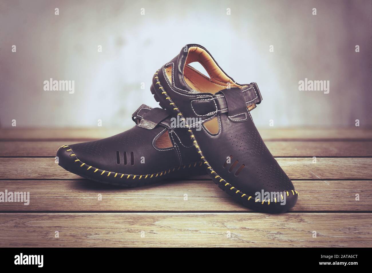 Children's leather trendy shoes isolated on wooden table Stock Photo
