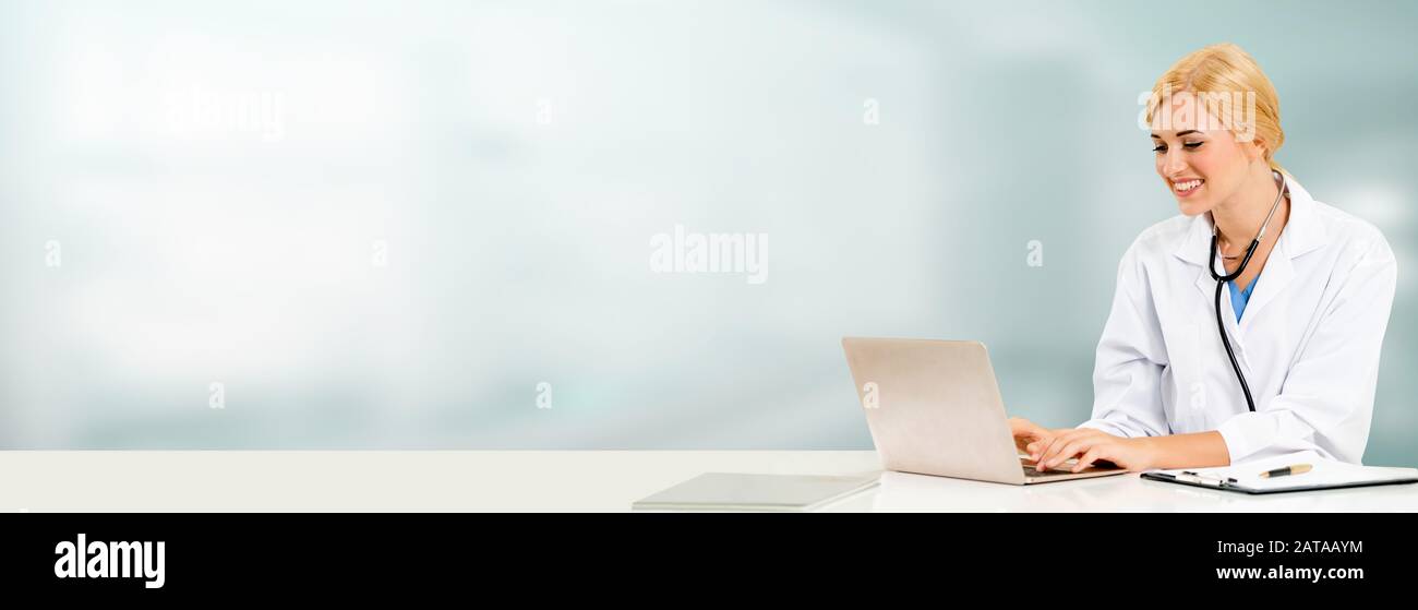 Doctor using laptop computer at the hospital. Medical healthcare and