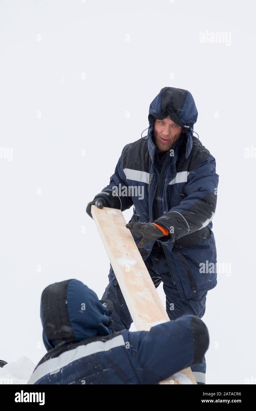 Two workers in overalls at a construction site Stock Photo Alamy